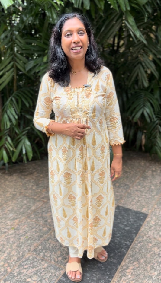 Maanvi Yellow Cotton A-Line Kurti with Collar Neck & Potli Button Detail | Pintuck Ethnic Wear with Pockets for Women