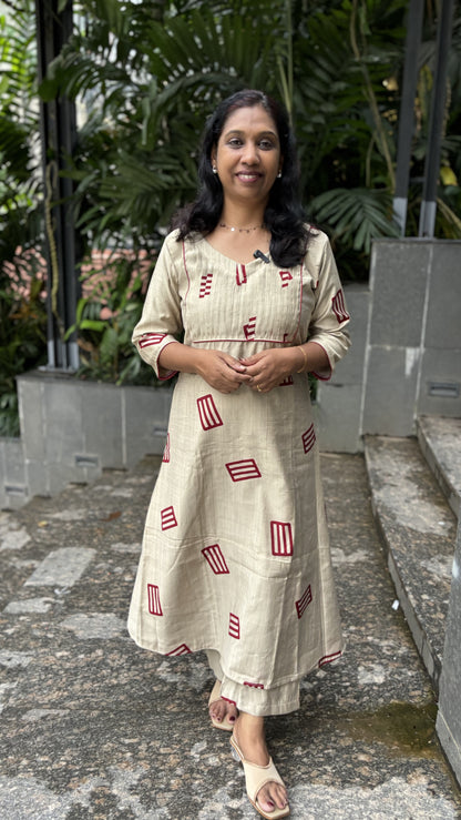Ivory Vattican Silk A-Line Cord Set with Maroon Prints, Pintuck , Pockets & Piping Detail | V-Neck | MA-2069